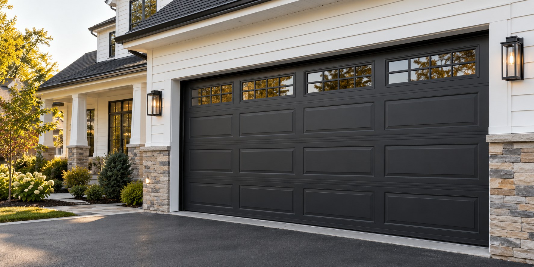 Charcoal sectional garage door on a welcoming suburban home